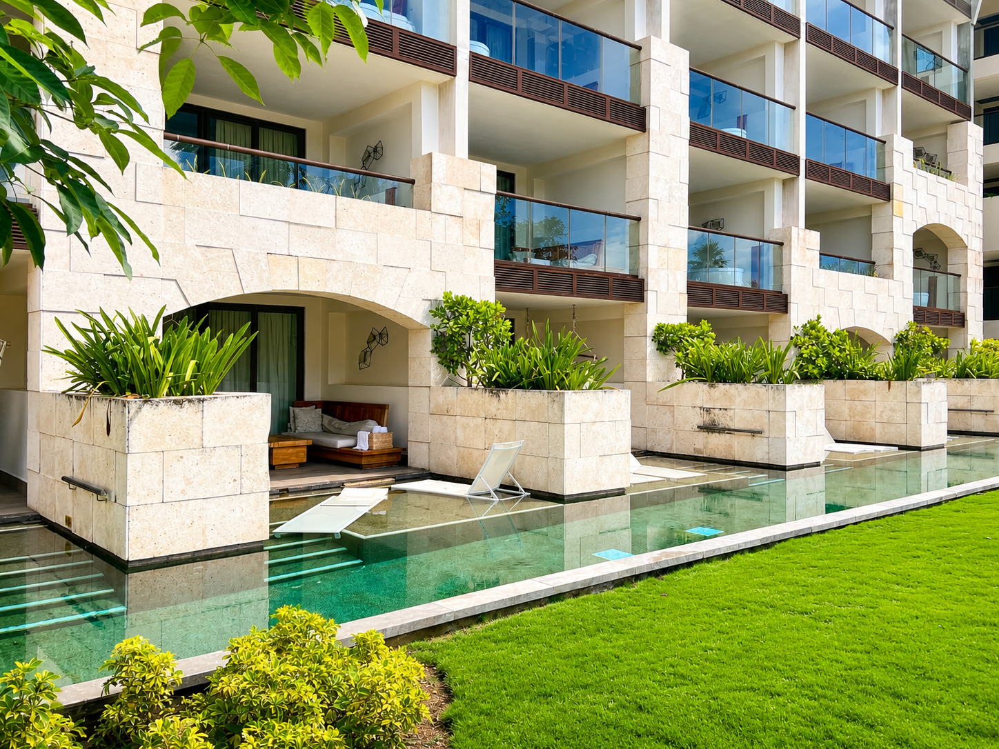 Swim-Up Suites — Step from your private terrace straight into a swim-up pool — resort architecture made for slow, sunlit days.